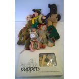 A collection of c1950s soft toys with a modern puppet kit.
