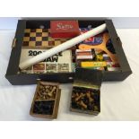 A box of vintage and modern games and playing cards. To include wooden chess pieces and Lotoo game.