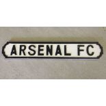 An Arsenal FC black & white sign (approx 13cm x 78cm).