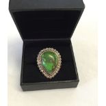 Sterling silver ring set with a green copper turquoise stone, Size J.