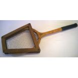 A vintage Spalding Bros wooden tennis raquet and frame.