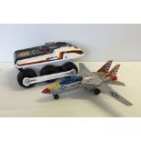 A tinplate & plastic Japanese Son Ai Toys fighter plane with a Bigtrac vehicle. In working order.