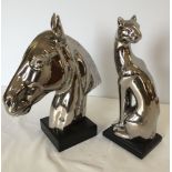 2 silver ceramic animal figures: 1) A horses head approx 28 wide x 32cm high, 2) A cat approx 12cm