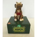 A c1960s RSPCA boxer dog charity collection box.