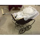 A vintage Leeway dolls pram.