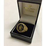 Gents 9ct gold ring set with engraved onyx stone, Size T, weight approx 7.9g.