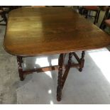 Oak gate leg table with barley twist legs.