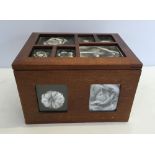 Wooden box for storing photographs.