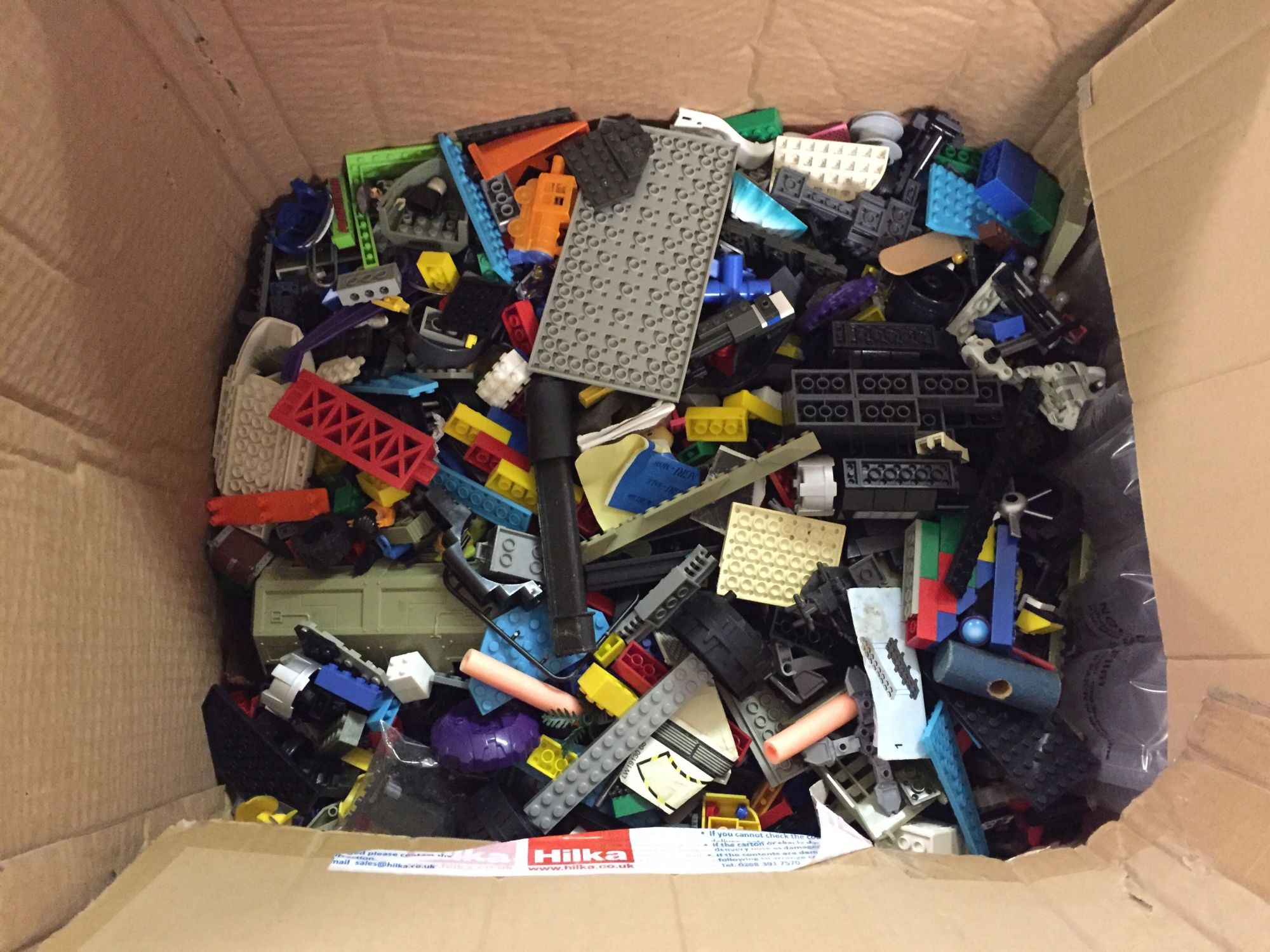 A large boxed assorted LEGO and Lego style bricks.