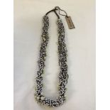 A cream and brown statement necklace by Jaeger. Decorated with 100's of small beads. Original