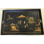 A black Toleware tray with an oriental design (approx 85cm x 55cm).