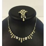 A matching diamante costume necklace and brooch.