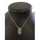 A 925 square shaped pendant set with a moonstone on a 16" silver chain.