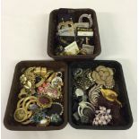 3 trays of vintage brooches, scarf clips & earrings.