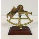 A reproduction brass sextant. A commemorative piece from 'The Discovery of America' seires 1492-