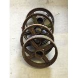 4 cast iron wheels, approx 34cm diameter.
