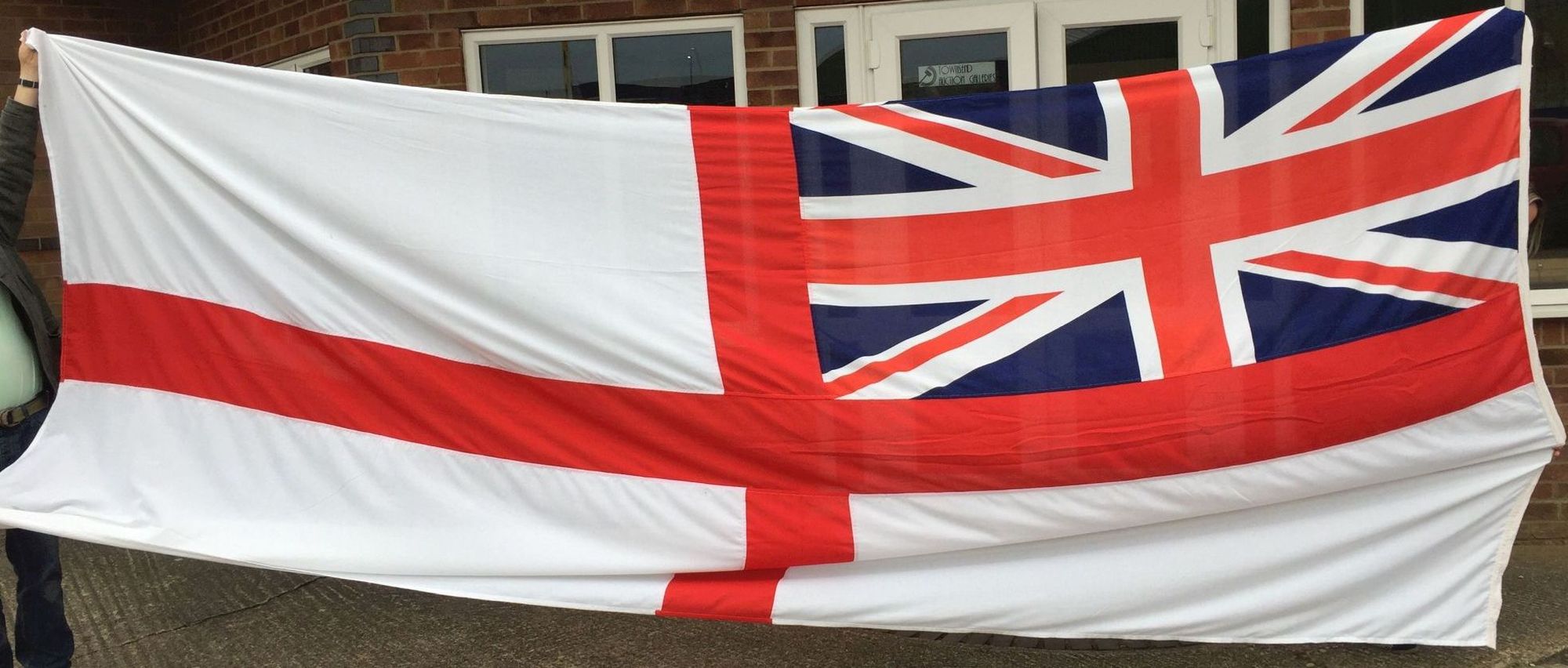 A large white ensign flag from the decommissioned aircraft carrier HMS Invincible (scrapped 2010).
