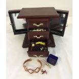 A small jewellery box containing a small quantity of costume jewellery.