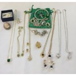 A quantity of costume jewellery to include, a cameo brooch, bangle and necklace & earring sets.