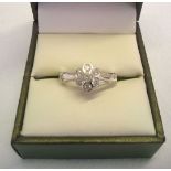 14ct white gold and diamond ring in a modern flower design cluster of 7 diamonds each approx 0.07ct.