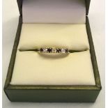 9ct gold half eternity ring set with 3 small diamonds and 4 sapphires. The word MUM is worked into