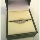 A white gold & diamond full eternity ring. Tests as 18ct. Size J«, total weight 1.8g.