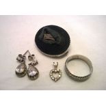 A collection of 4 silver items consisting of an antique carved bog oak brooch with Irish harp to