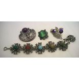 Small collection of Scottish style jewellery including a 'Miracle' brooch set with purple stones,