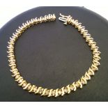 9ct gold ladies bracelet set with 47 individually set diamonds. Safety catch, marked 375. Approx