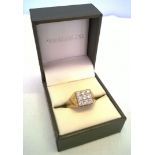 Gents 9ct gold ring set with 9 clear stones. Size T. Total weight 5.2g