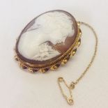 A Victorian 9ct gold cameo brooch/pendant with safety chain. Nicely carved, 4.5cm x 3.5cm,