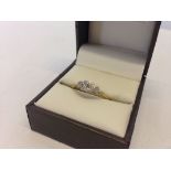 An 18ct gold & diamond trilogy ring. Diamonds set in a classic mount. Size R. Approx total weight