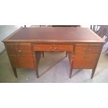 A vintage desk with brown leather top. 1 leg a/f approx 77cm high and 152cm wide x 83cm deep