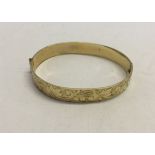 A 9ct rolled gold bangle