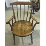 A stick back carver kitchen chair