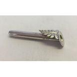 A silver buttonhole posy holder. Hallmarked Birmingham 1984, weighs approx 6g