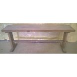 A wooden flat seated bench