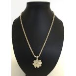 A heavy white metal clover leaf pendant on a 18 inch chain marked 925. Clover pendant unmarked.