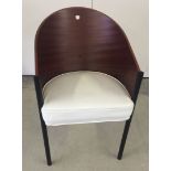 A Philippe Starck tub chair with white leather seat