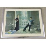 A large framed and glazed 1970's print of a man and woman relaxing at home with a cat. Picture