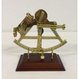 A reproduction brass sextant. A commemorative piece from 'The Discovery of America' series 1492-