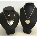 3 silver necklaces. 1, heart shaped set with diamante stones. 2, Triangular necklance/brooch and