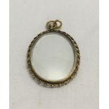 An antique gold and glass locket tests as approx 14ct gold. 7.9 g approx