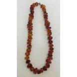 An 18 inch Amber necklace - irregular shaped stones. Weight approx 44.3g