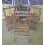 4 wooden folding garden chairs. 3 wooden seated and 1 with fabric back and seat.