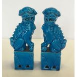 A pair of blue glazed temple dogs 21cm high