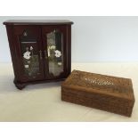 A dark wood jewellery cabinet with floral decoration to glass doors and 3 internal drawers,