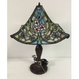 A modern Tiffany style lamp with leaded glass shade.