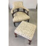 A vintage nursing chair with brass casters in gold foliage material together with a matching stool