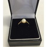 A 9ct gold ring set with a pearl. Size L Approx 1.2g